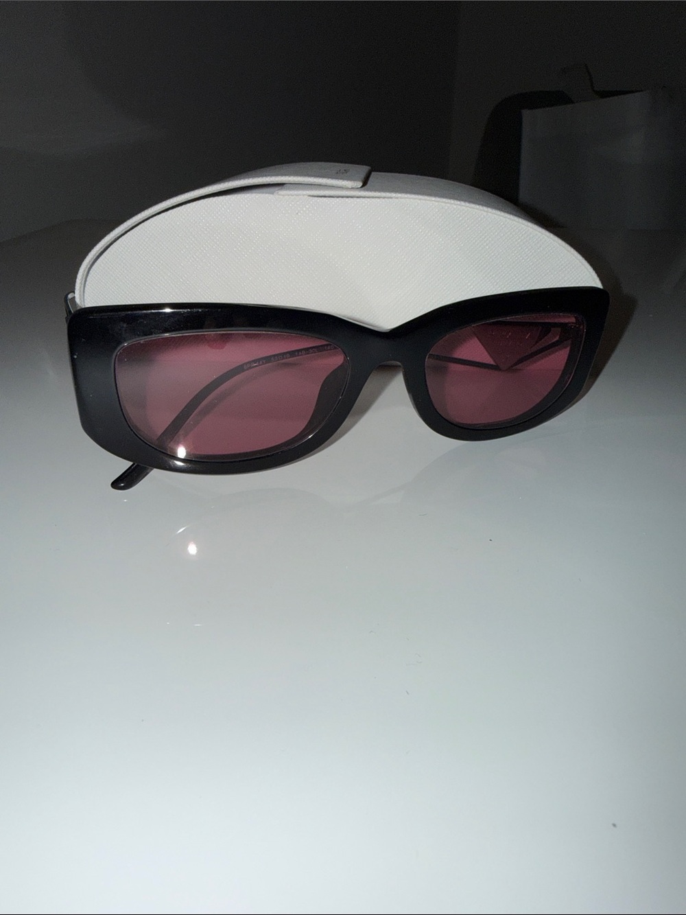 Prada Black Frame Sunglasses with Rose Lenses